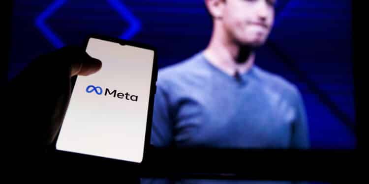 Meta logo on screen and Mark Zuckerberg is a Chief Executive Officer of Metaverse in background