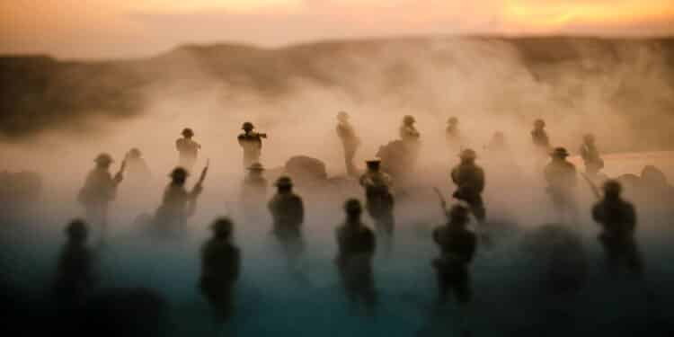 War Concept. Military silhouettes fighting scene on war fog sky background, World War Soldiers Silhouettes Below Cloudy Skyline At night. Attack scene. Armored vehicles