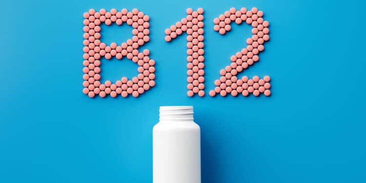 3d Empty White Pill Bottle With B12 Text Made Of Rounded Vitamin B12 Tablets 3d Illustration