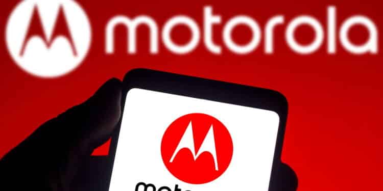 December 14, 2021, Brazil. In this photo illustration the Motorola logo seen displayed on a smartphone and on the background