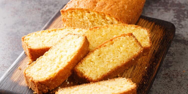 Madeira loaf cake closeup served on a wooden cutting board